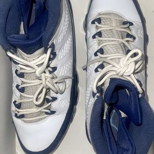 BLUE AND WHITE JORDAN 9s , WORN